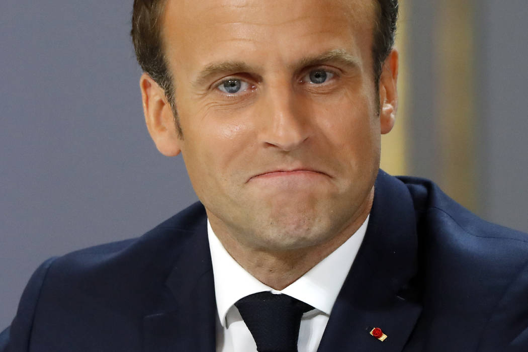 French President Emmanuel Macron reacts after delivering a speech at the Elysee Palace Thursday ...