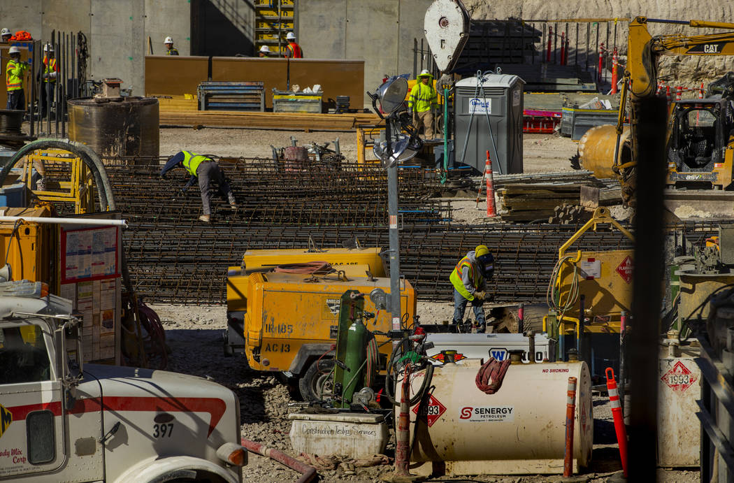 Construction continues at the under-development Circa viewed from a porthole in the Fremont exp ...