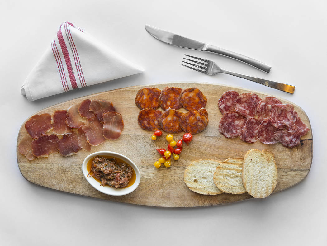 Salchichon, acorn-fed Iberico salami, chorizo Iberico, dry Iberico cured sausage and lomo Iberi ...