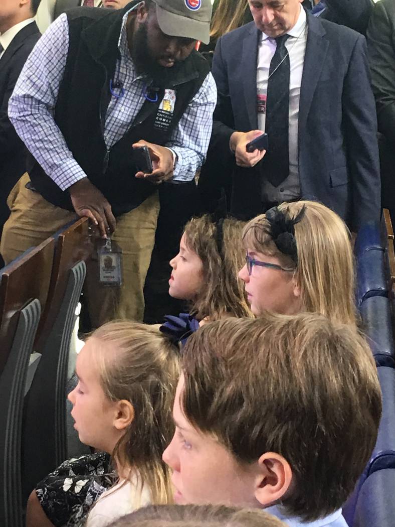 Ava and Evelyn Cook -- seen with black bows in their hair -- try out their chops as White House ...