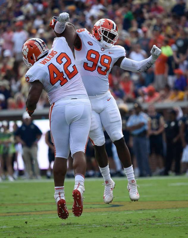 In this Sept. 22, 2018, file photo, Clemson defensive end Clelin Ferrell (99) and defensive lin ...