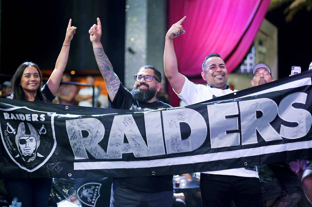 Veronica Diaz, from left, Hector Leyva, and Kevin Shaughnessy react to the 27th draft pick of s ...