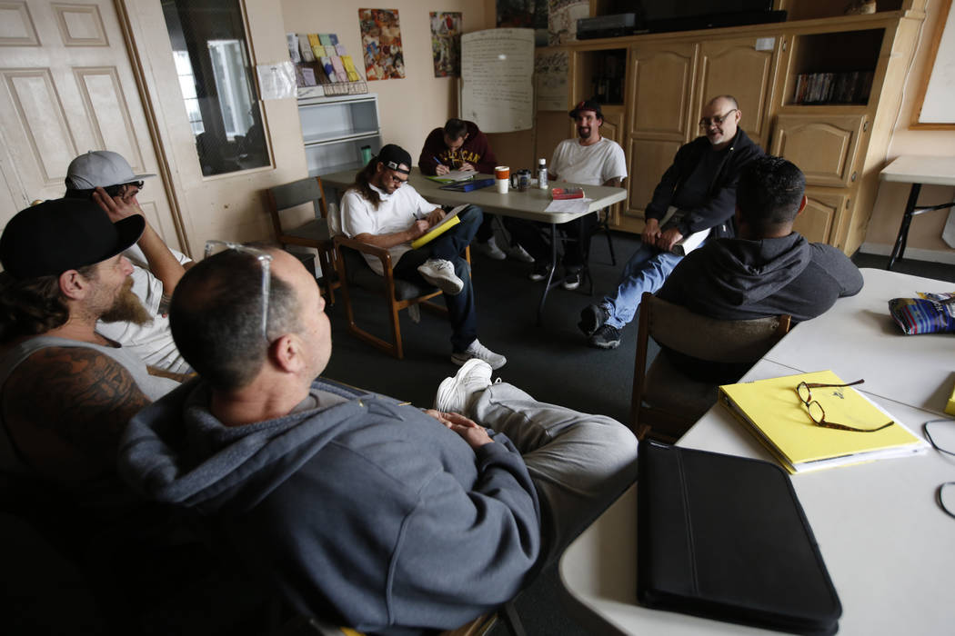 Program manager Dave Cross, right, leads a discussion Feb. 20, 2019, about living in sobriety w ...