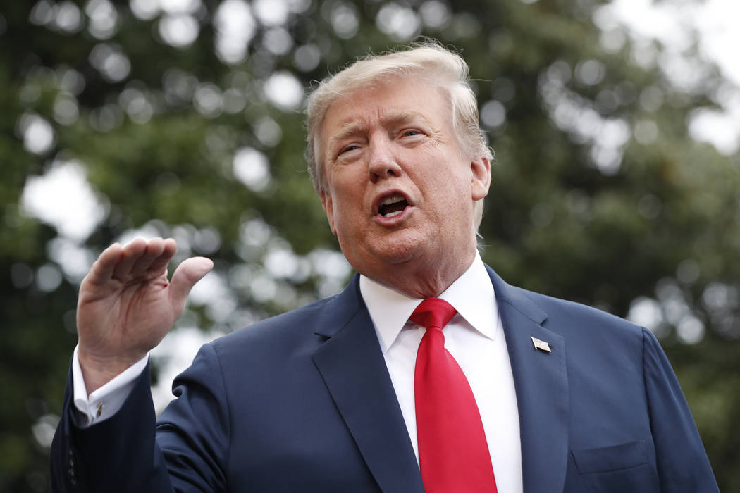 President Donald Trump speaks to the media as he departs the White House on Friday April 26, 20 ...