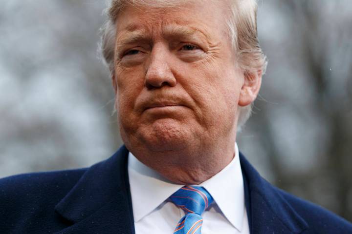 President Donald Trump speaks with reporters before boarding Marine One on the South Lawn of th ...