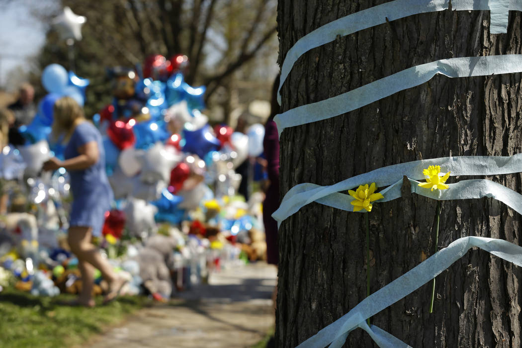 A memorial for 5-year-old Andrew "AJ" Freund grows outside of his family's home on Th ...