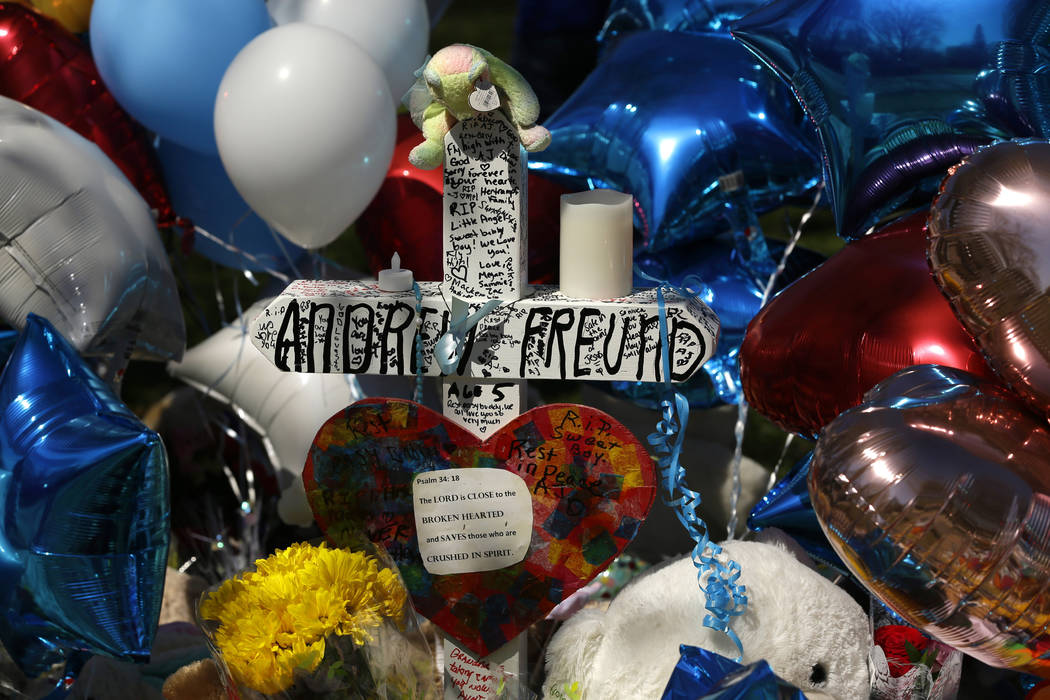 A memorial for 5-year-old Andrew "AJ" Freund grows outside of his family's home on Th ...