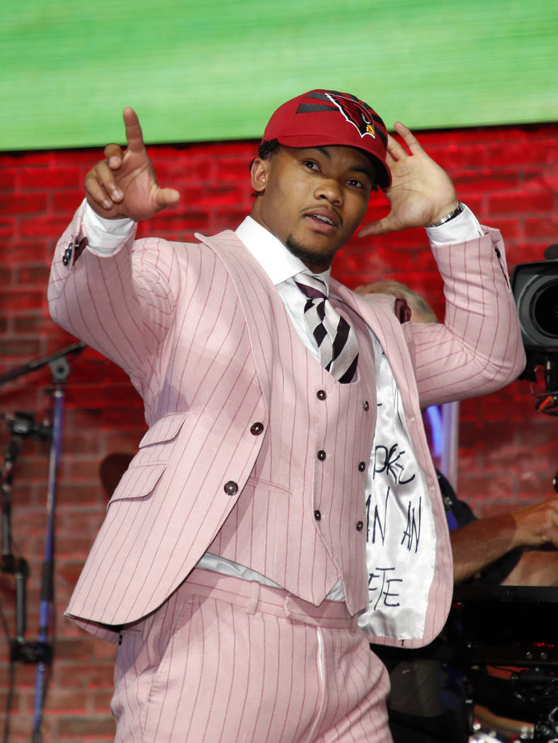 Oklahoma quarterback Kyler Murray enters the main stage after the Arizona Cardinals selected Mu ...