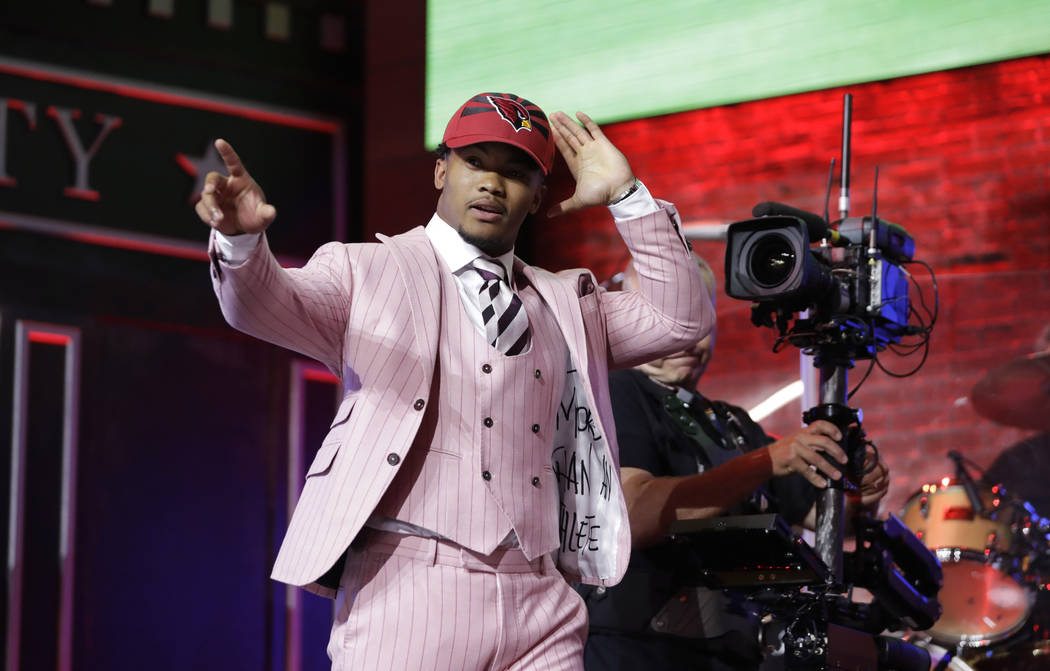 Oklahoma quarterback Kyler Murray enters the main stage after the Arizona Cardinals selected Mu ...