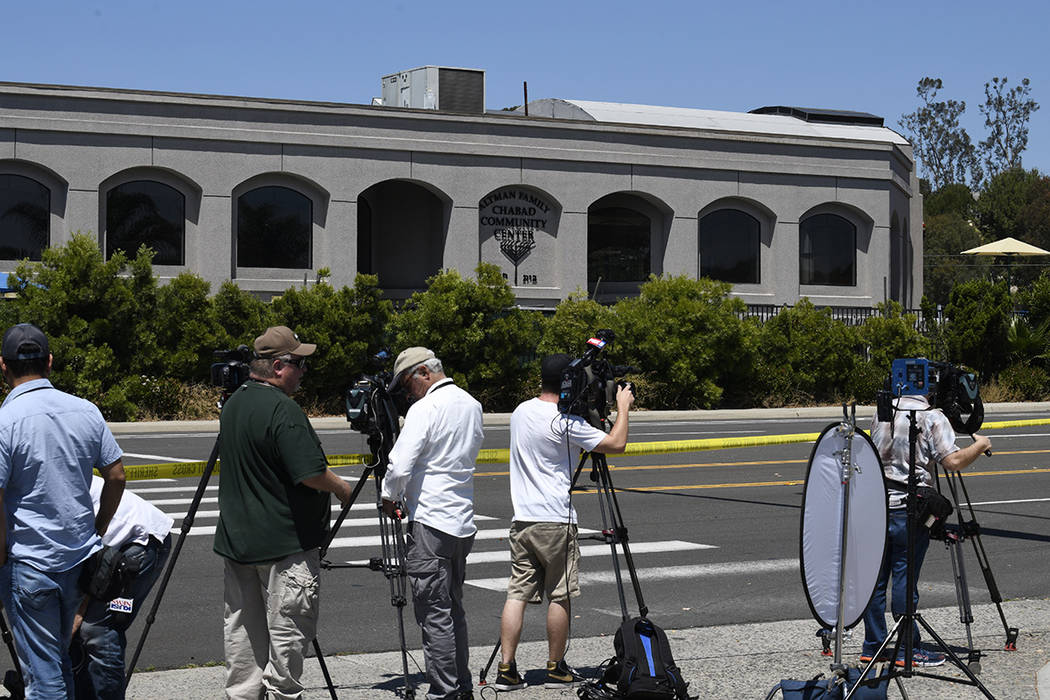 Television cameras film the outside of the Chabad of Poway Synagogue Saturday, April 27, 2019, ...