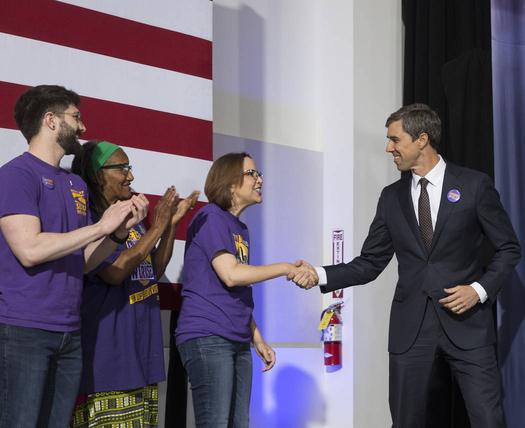 Presidential candidate and former Texas congressman Beto O'Rourke, right, shakes hands with sup ...