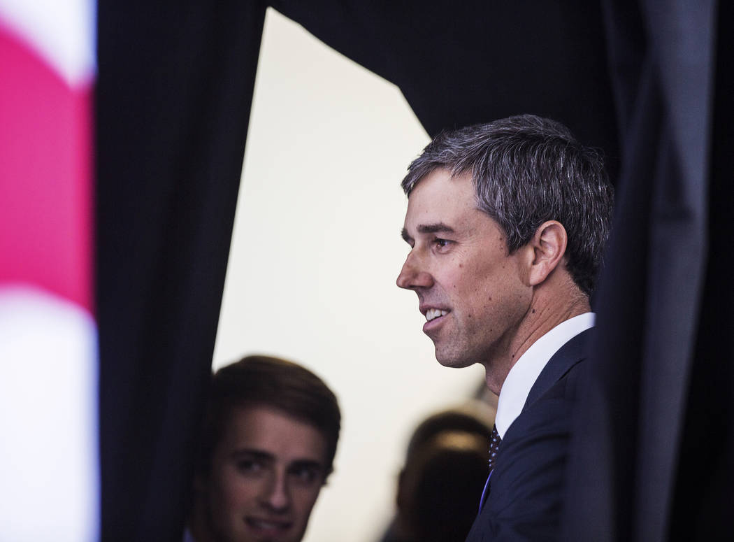 Presidential candidate and former Texas congressman Beto O'Rourke, right, speaks with supporter ...