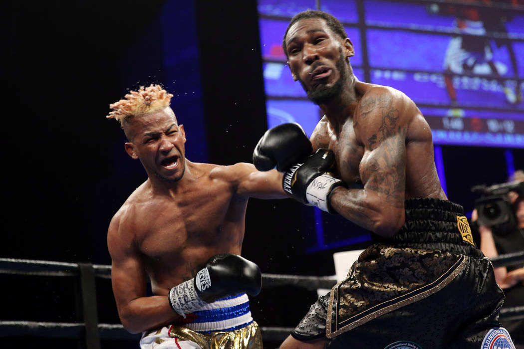 Rances Barthelemy, left, throws a punch against Robert Easter Jr. in the WBA lightweight champi ...