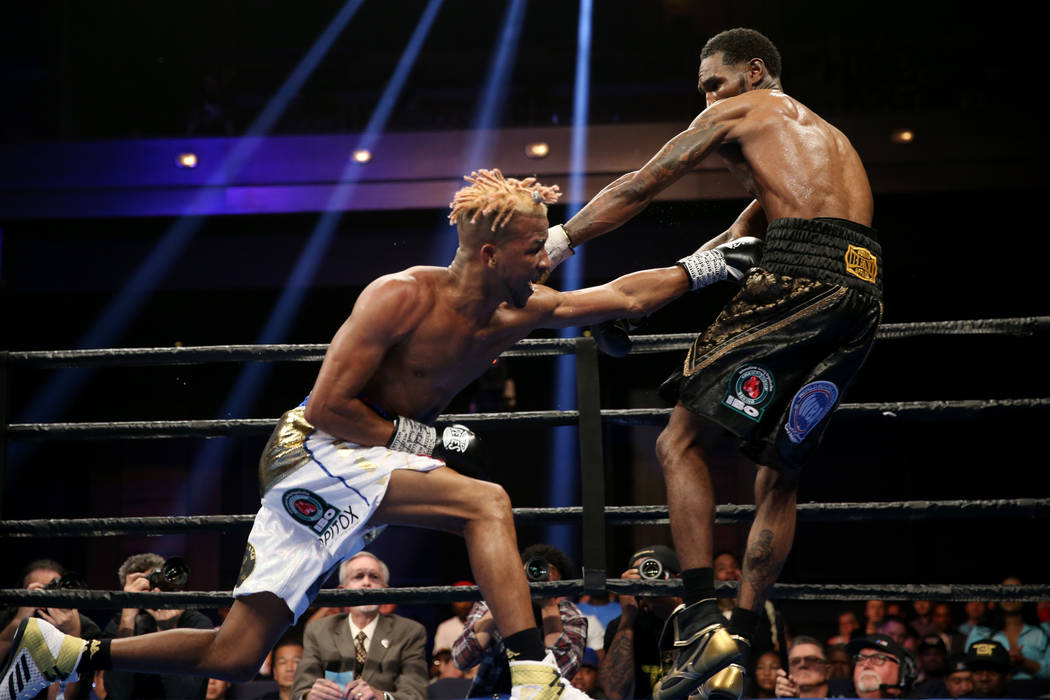 Rances Barthelemy, left, throws a punch against Robert Easter Jr. in the WBA lightweight champi ...