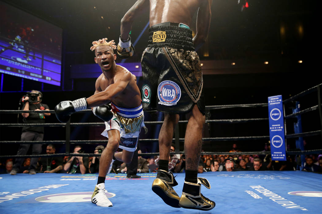 Rances Barthelemy, left, throws a punch against Robert Easter Jr. in the WBA lightweight champi ...