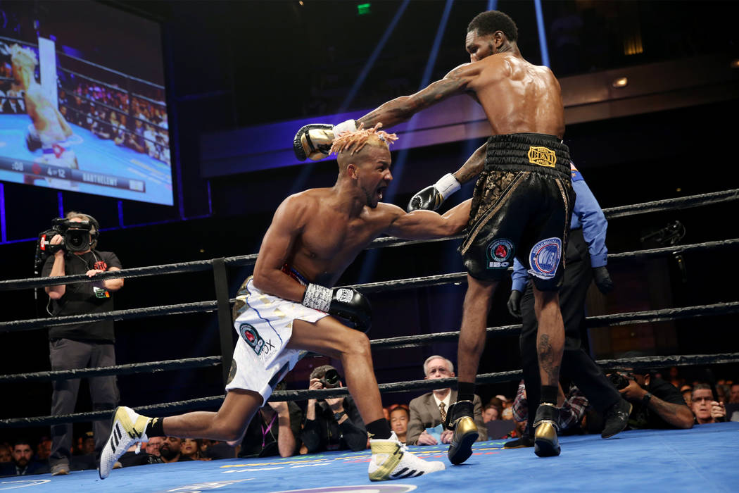 Rances Barthelemy, left, throws a punch against Robert Easter Jr. in the WBA lightweight champi ...