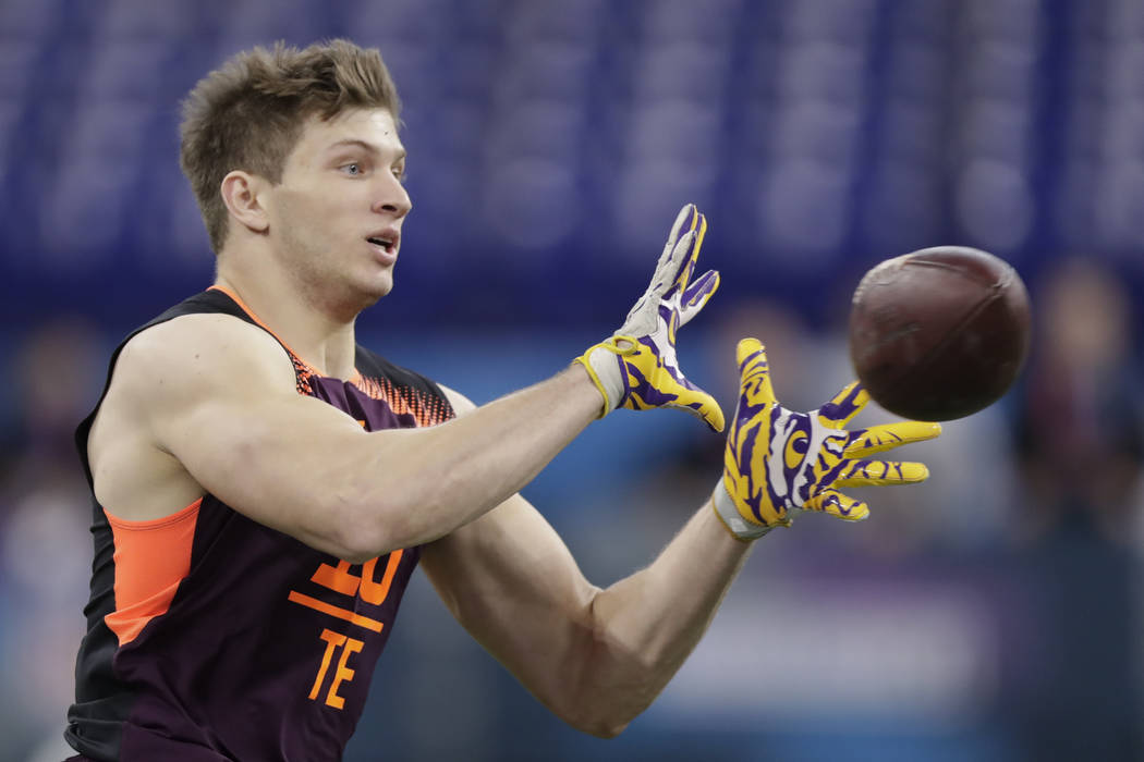 LSU tight end Foster Moreau runs a drill at the NFL football scouting combine in Indianapolis, ...