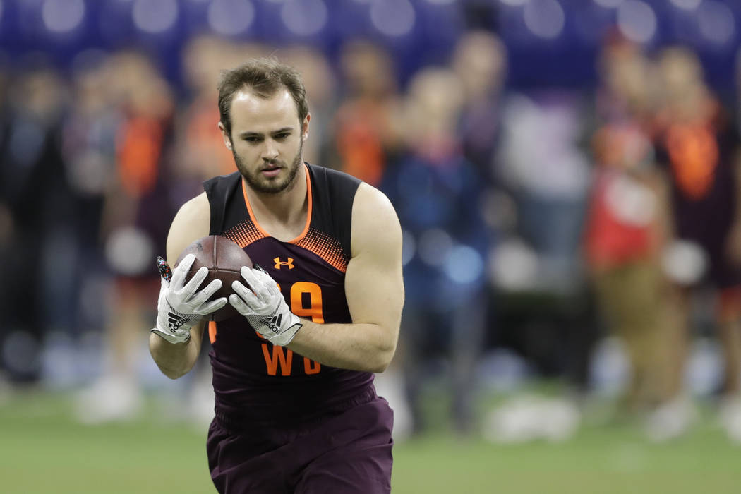 Clemson wide receiver Hunter Renfrow runs a drill during the NFL football scouting combine, Sat ...