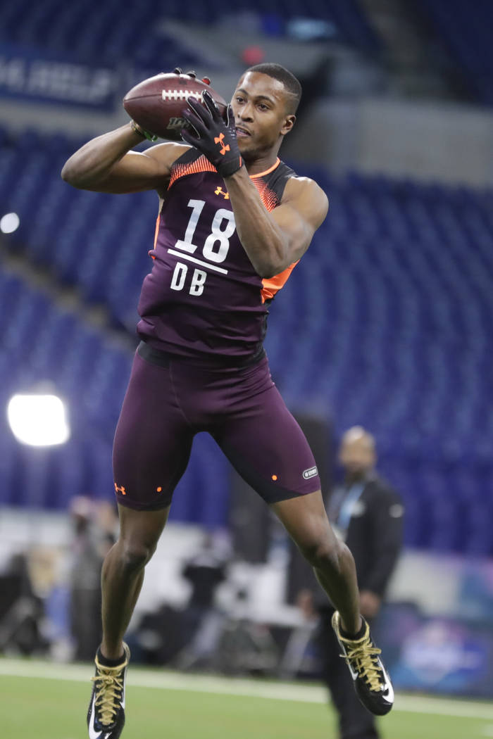 Houston defensive back Isaiah Johnson runs a drill at the NFL football scouting combine in Indi ...