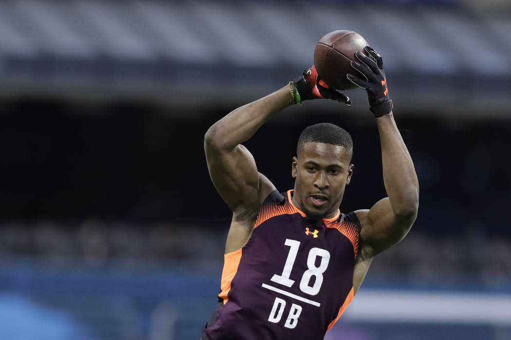 Houston defensive back Isaiah Johnson runs a drill during the NFL football scouting combine, Mo ...