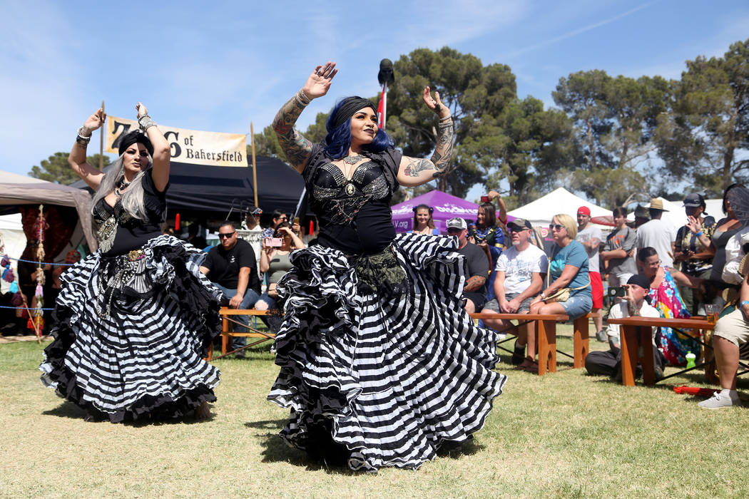 Cindy Aragon-Harris, left, and Brianna Castillo, right, dance as part of the Fuego Fusion profe ...