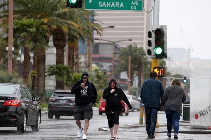 Keith and Kimberly Spahr, of Cincinnati, Ohio, cross Sahara Avenue at Las Vegas Boulevard in La ...