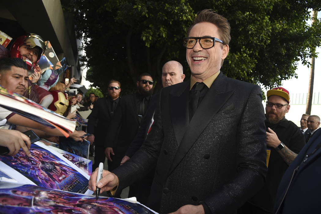 Robert Downey Jr. signs autographs as he arrives at the premiere of "Avengers: Endgame&quo ...