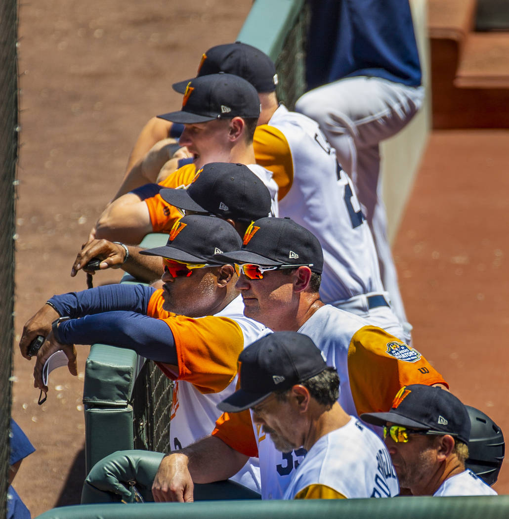Aviators manager Fran Riordan (39) (center) is joined by others watching their team bat versus ...