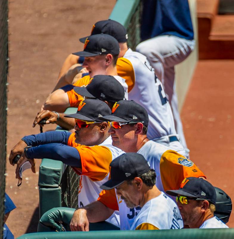 Aviators manager Fran Riordan (39) (center) is joined by others watching their team bat versus ...