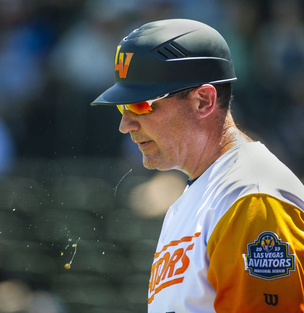 Aviators manager Fran Riordan (39) spits out some juice while guiding his team versus El Paso o ...