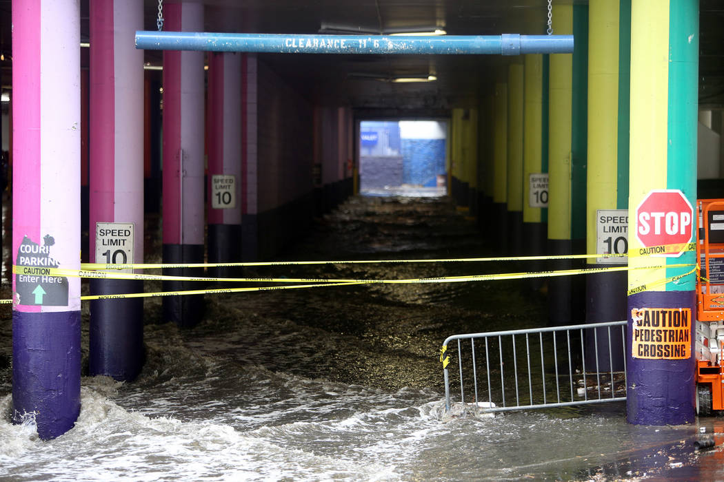 Rain causes flooding at The Linq Hotel and casino parking garage in Las Vegas, Monday, April 29 ...