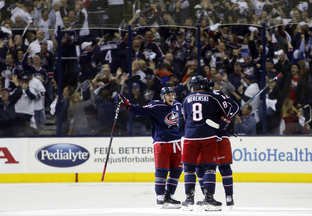 Columbus Blue Jackets players celebrate their goal against the Tampa Bay Lightning during the t ...