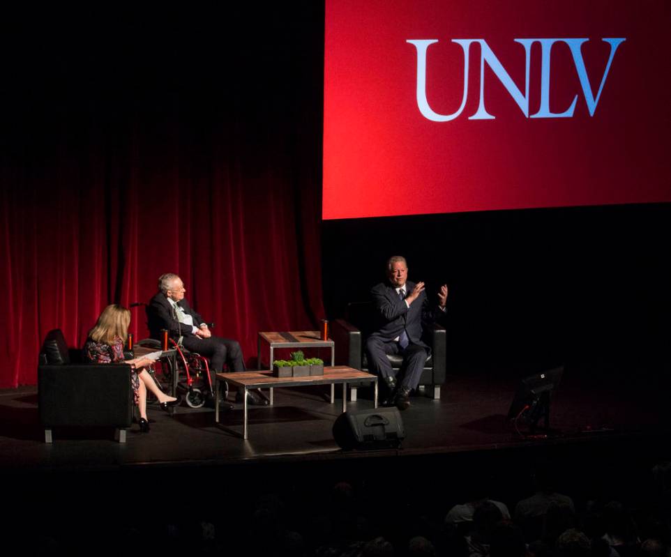 Former U.S. Vice President Al Gore, top/right, discusses climate change with former Sen. Harry ...