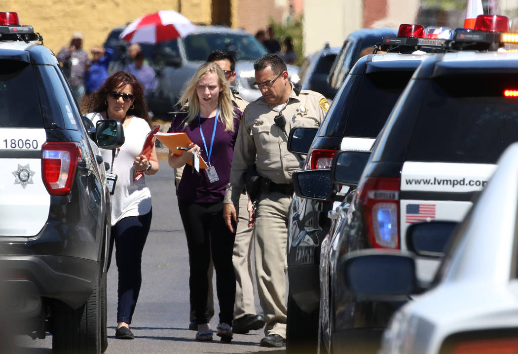 The Metropolitan Police Department investigates a shooting in the 3200 block of Silver Saddle S ...