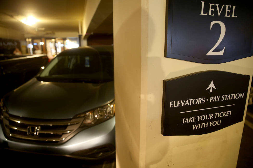 Parking garage at Wynn Las Vegas includes signs directing customers to parking pay stations Mon ...