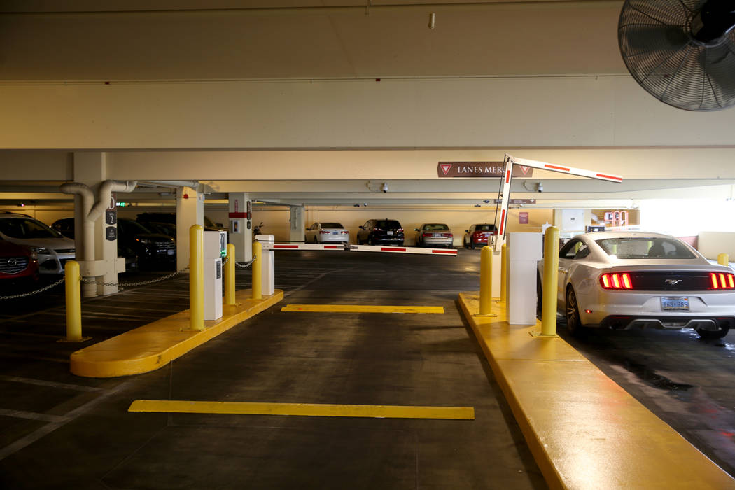 A customer takes a ticket for paid parking in the garage at Wynn Las Vegas Monday, April 29, 20 ...