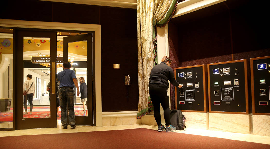 A customer pays for parking before going to the garage at Wynn Las Vegas Monday, April 29, 2019 ...