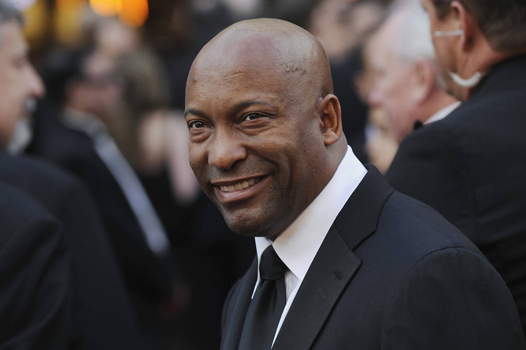 FILE - In this Feb. 24, 2008 file photo, director John Singleton arrives at the 80th Academy Aw ...