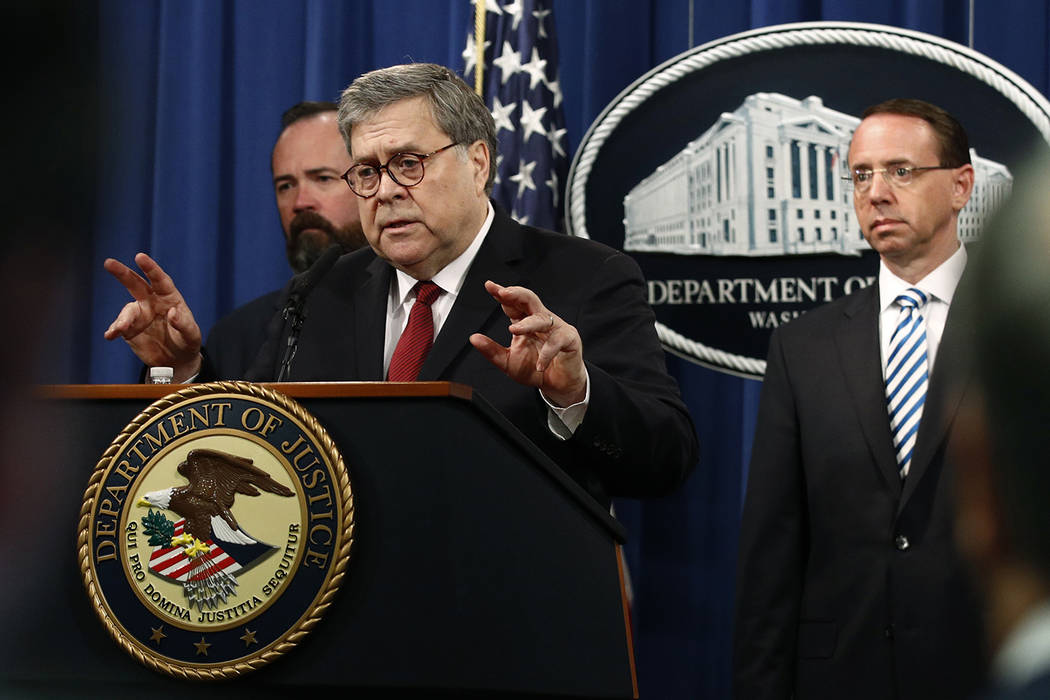 Attorney General William Barr speaks alongside Deputy Attorney General Rod Rosenstein, right, a ...