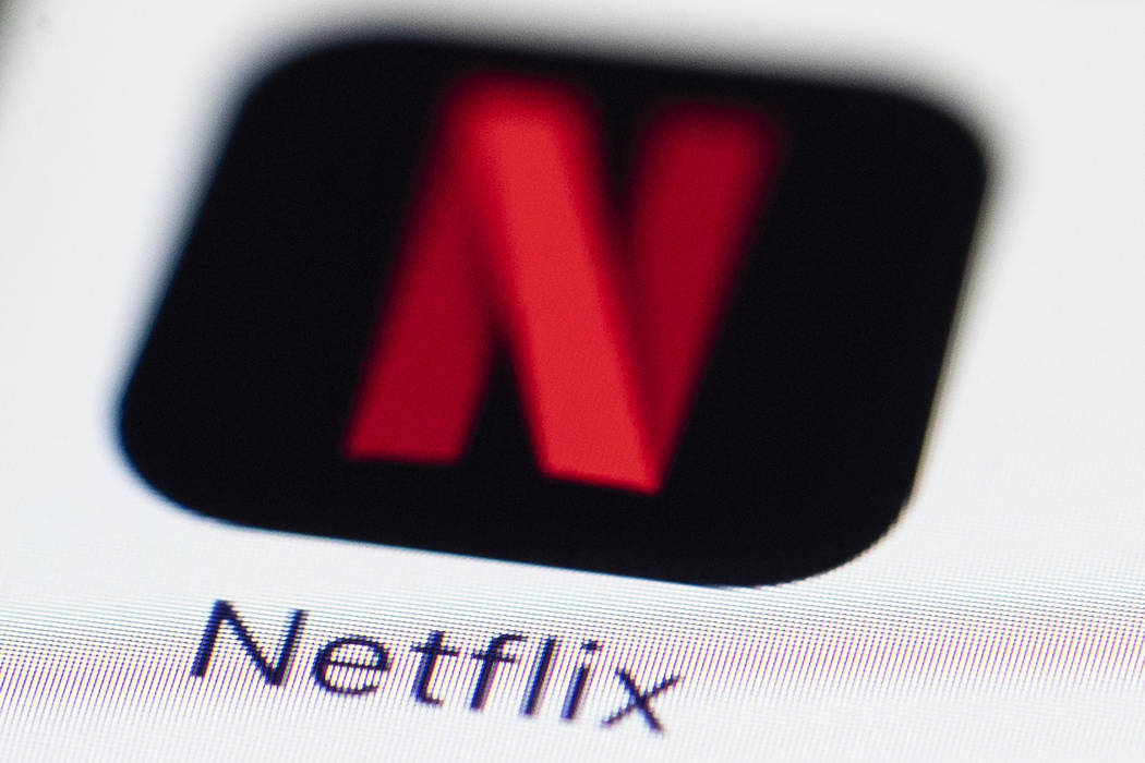 This July 17, 2017, photo shows a Netflix logo on an iPhone in Philadelphia. (AP Photo/Matt Rourke)