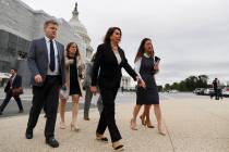 House Speaker Nancy Pelosi of Calif., second from right, arrives for a news conference on veter ...