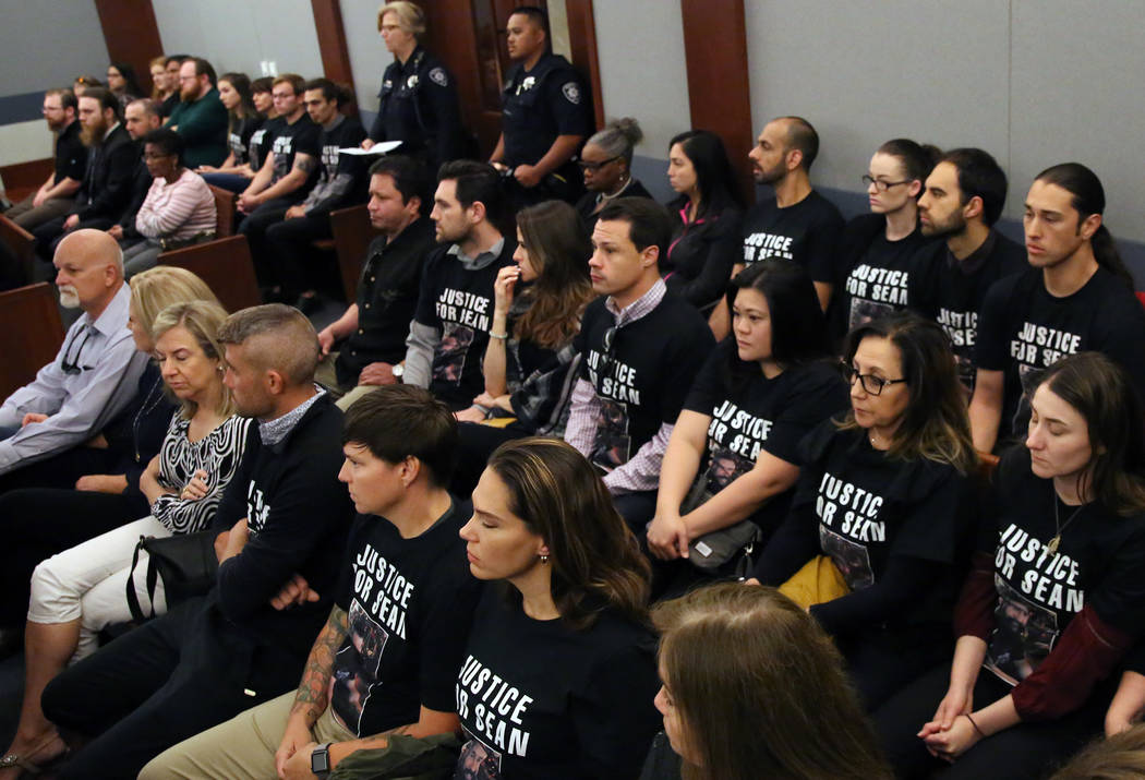 Family members and friends wearing ''Justice for Sean" T-shirts attend former Metro office ...