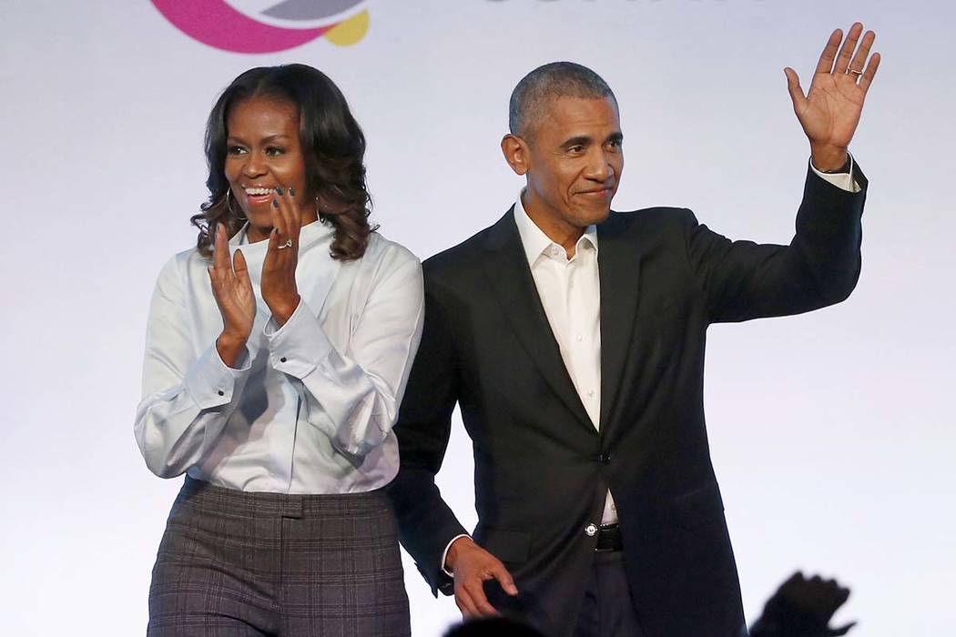 Former President Barack Obama, right, and former first lady Michelle Obama appear Oct. 31, 2017 ...