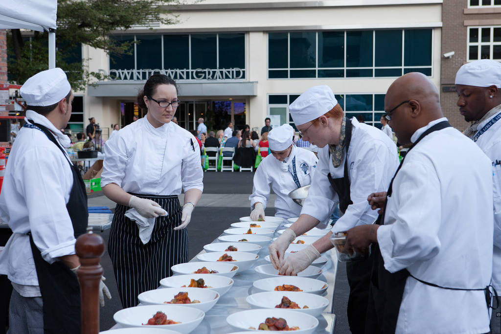 Servers prepare to present dishes at Project Dinner Table event at Downtown3rd in 2014. (Specia ...