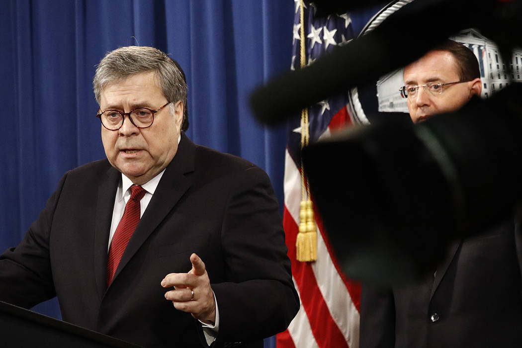 Attorney General William Barr speaks alongside Deputy Attorney General Rod Rosenstein about the ...