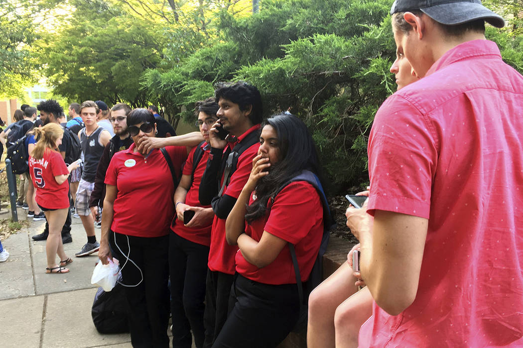 Students gather on the campus of the University of North Carolina Charlotte after a shooting Tu ...