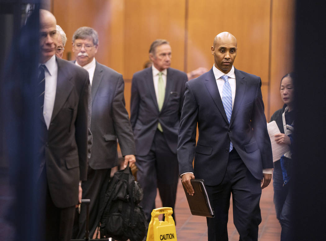 Former Minneapolis police officer Mohamed Noor walks through the elevator lobby of the Hennepin ...