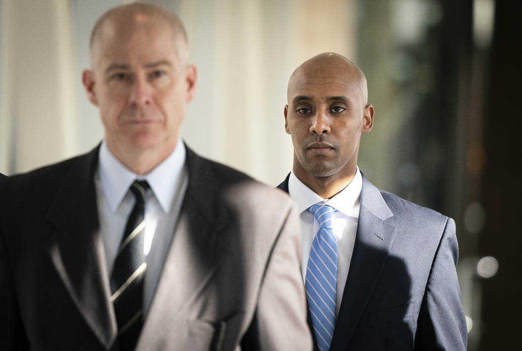 Former Minneapolis police officer Mohamed Noor walks through the skyway with his attorney Thoma ...