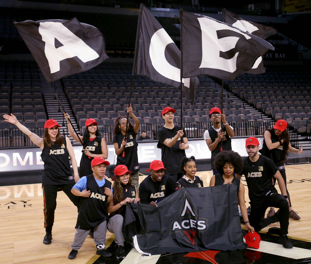 Members of the WNBA Las Vegas Aces Wild Card Crew, pose for a team photo after finding out they ...