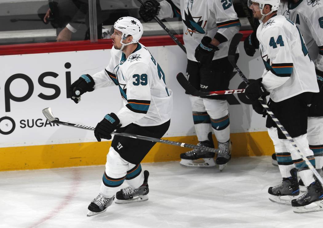 San Jose Sharks center Logan Couture celebrates after scoring an empty-net goal against the Col ...